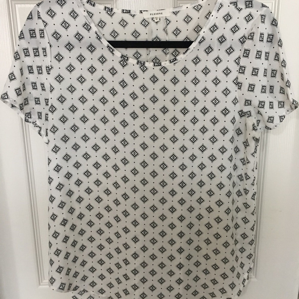 White blouse. Black accents.